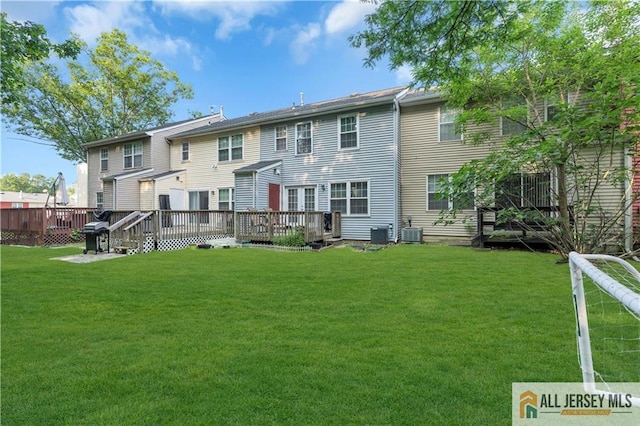 52 Lantern Ln, Sayreville, NJ 08872 - back of house featuring a deck and a lawn