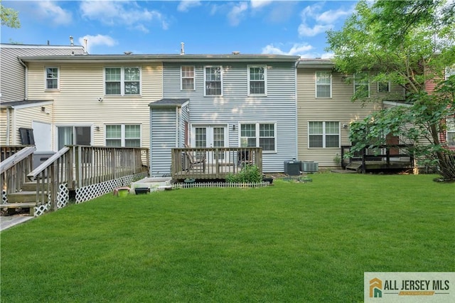 52 Lantern Ln, Sayreville, NJ 08872 - rear view of property featuring a deck and a lawn