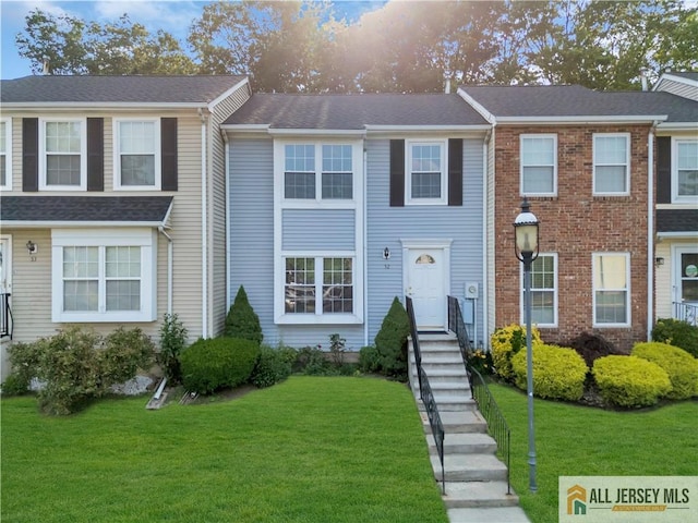 52 Lantern Ln, Sayreville, NJ 08872 - townhome / multi-family property with a front lawn