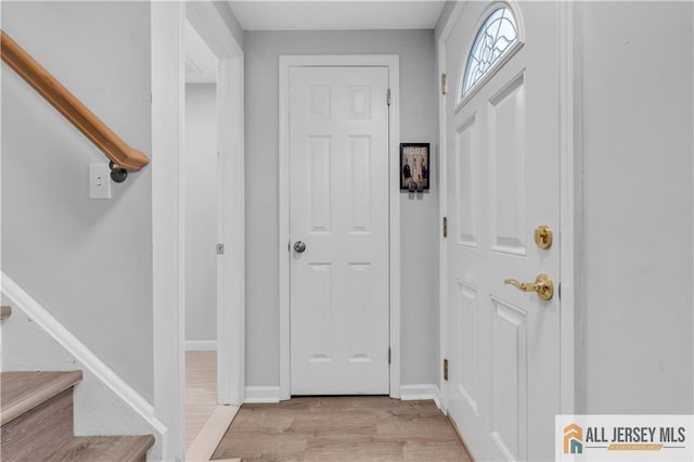 52 Lantern Ln, Sayreville, NJ 08872 - entryway featuring light wood-style flooring and stairs