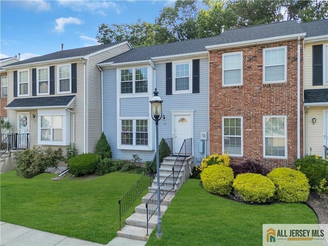 52 Lantern Ln, Sayreville, NJ 08872 - multi unit property featuring a front yard and brick siding