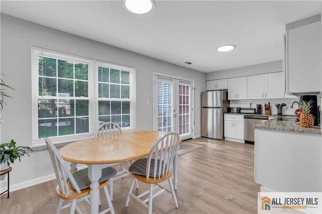 52 Lantern Ln, Sayreville, NJ 08872 - dining area featuring healthy amount of natural light and light wood-type flooring