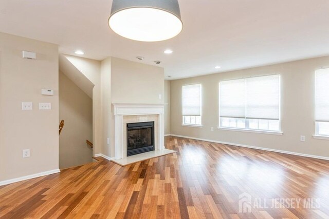 unfurnished living room featuring light hardwood / wood-style floors