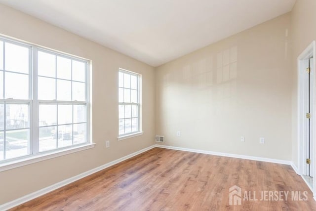 empty room featuring light hardwood / wood-style floors