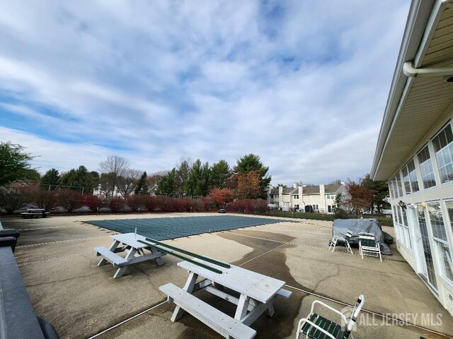 view of swimming pool featuring a patio area