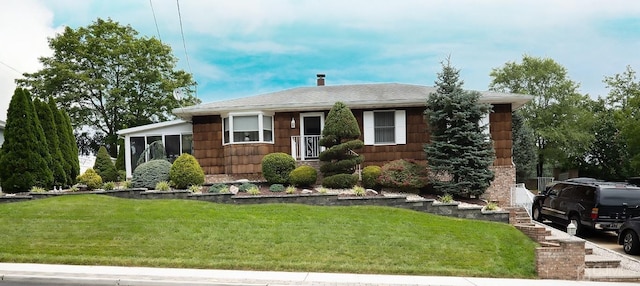 ranch-style house featuring a front lawn