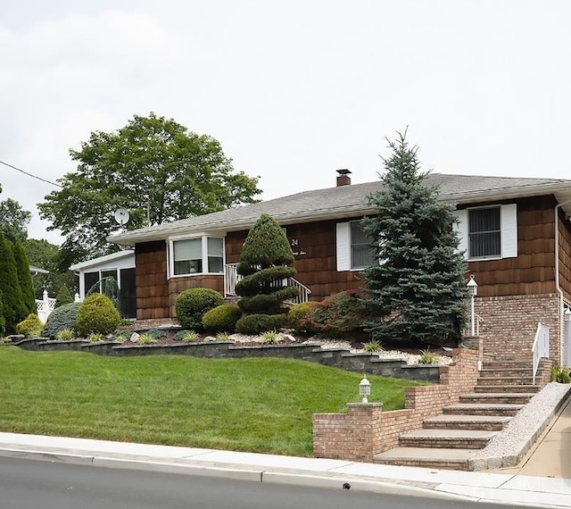 ranch-style house with a front yard