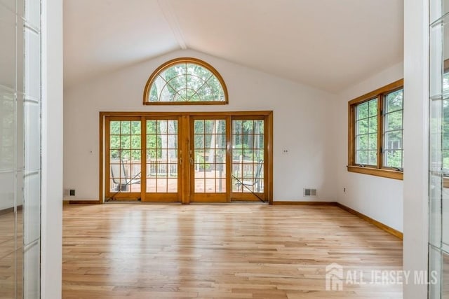 42 Corona Rd, East Brunswick, NJ 08816 - entryway featuring light wood-style flooring, healthy amount of natural light, and lofted ceiling