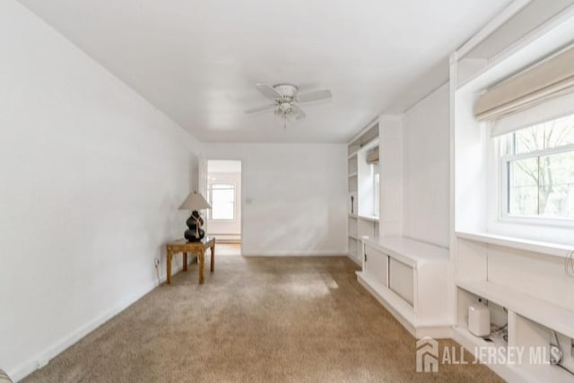 42 Corona Rd, East Brunswick, NJ 08816 - unfurnished room featuring healthy amount of natural light, a ceiling fan, and light carpet