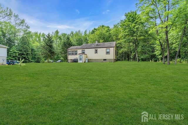 211 E Greystone Rd, Old Bridge, NJ 08857 - back of house with a lawn