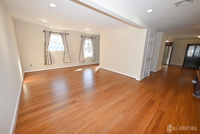 empty room with wood-type flooring