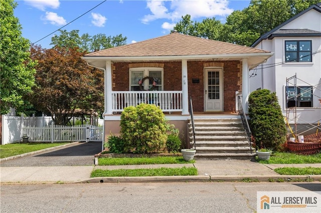 28 Wildwood Ave, Fords, NJ 08863 - bungalow with a porch, brick siding, and roof with shingles