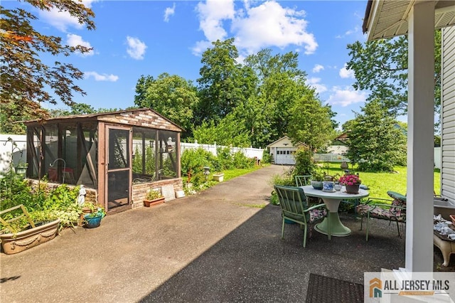 28 Wildwood Ave, Fords, NJ 08863 - view of patio featuring an outdoor structure and outdoor dining space