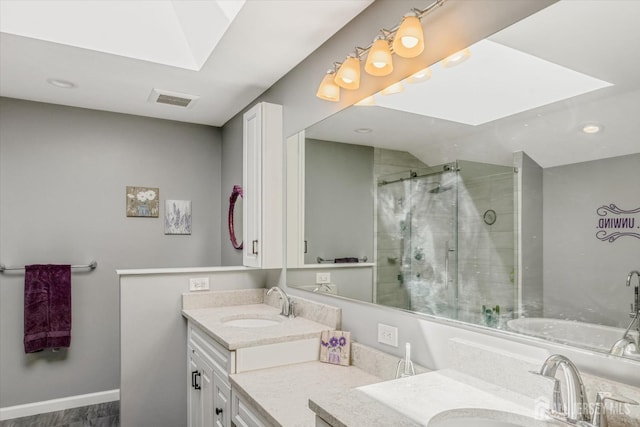 441 Sayre Dr, Plainsboro, NJ 08540 - bathroom with a shower stall, a skylight, double vanity, recessed lighting, and baseboards