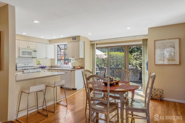 441 Sayre Dr, Plainsboro, NJ 08540 - dining room with light wood-style flooring, baseboards, and recessed lighting
