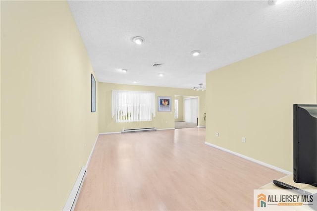 703 Croydon Rd Unit 703B, Monroe, NJ 08831 - unfurnished living room featuring a baseboard heating unit, wood finished floors, baseboard heating, and recessed lighting