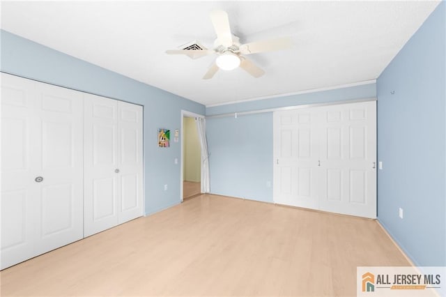 703 Croydon Rd Unit 703B, Monroe, NJ 08831 - unfurnished bedroom with light wood-style flooring, a ceiling fan, and a closet
