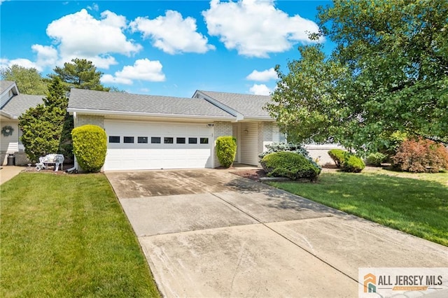 703 Croydon Rd Unit 703B, Monroe, NJ 08831 - view of front facade with a garage, concrete driveway, and a front yard
