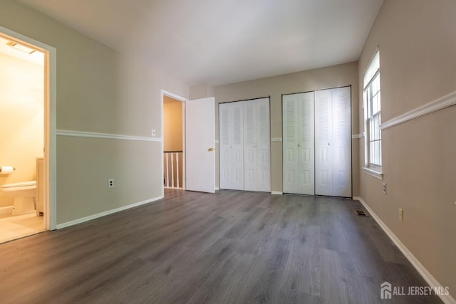 72 Morgan Pl E, Brunswick, NJ 08816 - unfurnished bedroom featuring multiple closets, wood finished floors, and ensuite bath
