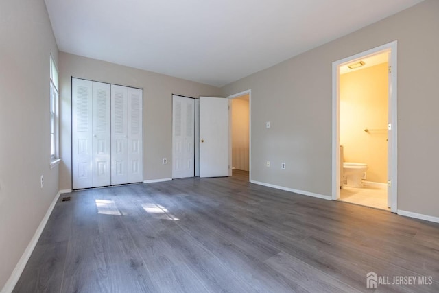72 Morgan Pl E, Brunswick, NJ 08816 - unfurnished bedroom with multiple closets, wood finished floors, and ensuite bathroom