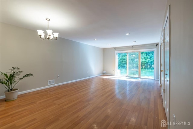 72 Morgan Pl E, Brunswick, NJ 08816 - empty room with a chandelier, light wood-style flooring, and recessed lighting