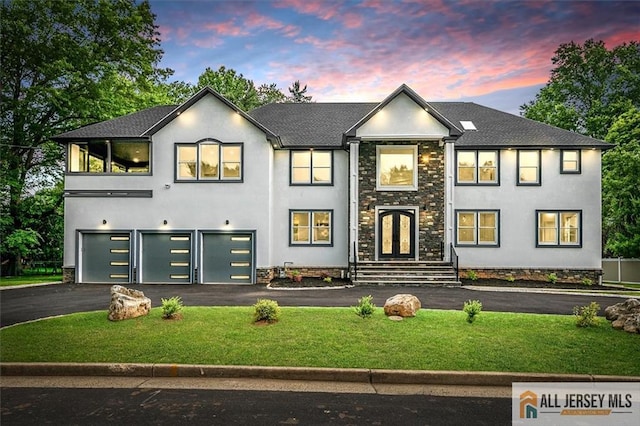 4 Hemlock Dr, Edison, NJ 08820 - view of front of property with driveway, a garage, a front yard, and stucco siding