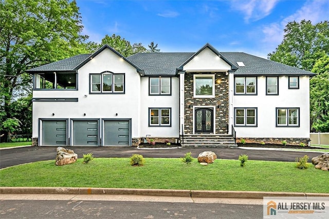 4 Hemlock Dr, Edison, NJ 08820 - view of front of property featuring asphalt driveway, stucco siding, and an attached garage