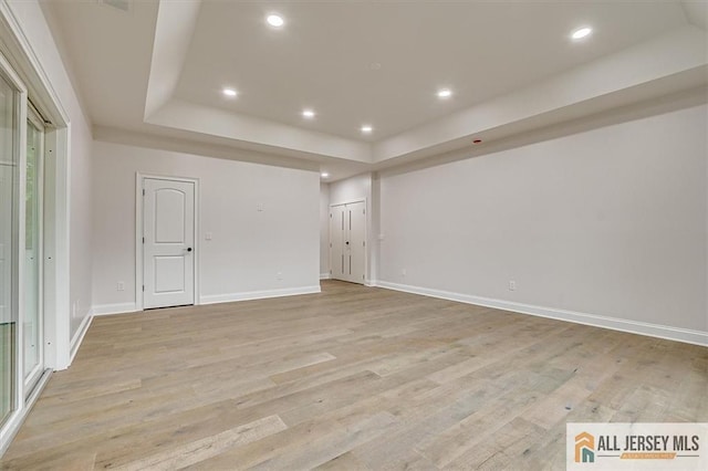 4 Hemlock Dr, Edison, NJ 08820 - empty room featuring a tray ceiling, light wood-style floors, recessed lighting, and baseboards