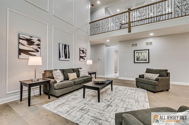 4 Hemlock Dr, Edison, NJ 08820 - living area with a towering ceiling, wood finished floors, baseboards, and recessed lighting
