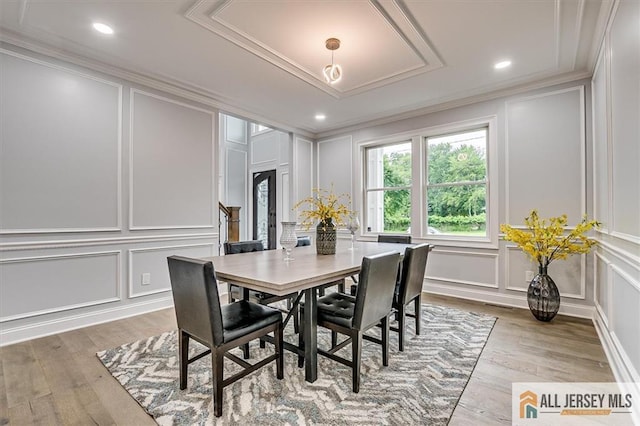 4 Hemlock Dr, Edison, NJ 08820 - dining area featuring a decorative wall, ornamental molding, and light wood-type flooring