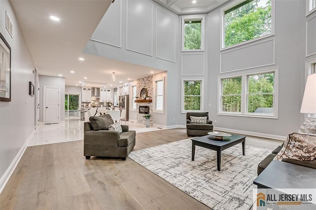 4 Hemlock Dr, Edison, NJ 08820 - living room with light wood finished floors, baseboards, recessed lighting, and a towering ceiling