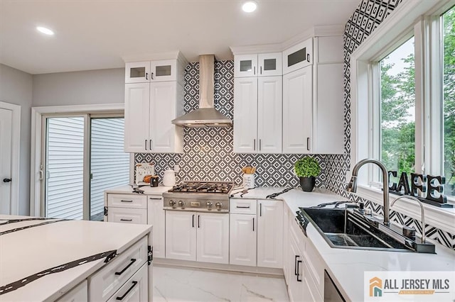 4 Hemlock Dr, Edison, NJ 08820 - kitchen with wall chimney exhaust hood, stainless steel gas cooktop, a sink, light marble finish flooring, and decorative backsplash