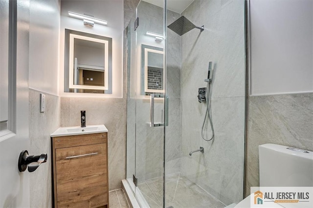 4 Hemlock Dr, Edison, NJ 08820 - full bathroom with tile walls, a stall shower, vanity, and toilet