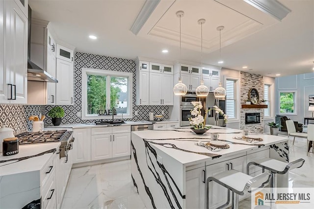 4 Hemlock Dr, Edison, NJ 08820 - kitchen with a sink, light marble finish floors, a breakfast bar, stainless steel appliances, and light countertops