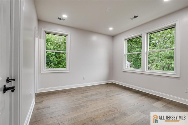 4 Hemlock Dr, Edison, NJ 08820 - unfurnished room featuring plenty of natural light, wood finished floors, baseboards, and recessed lighting
