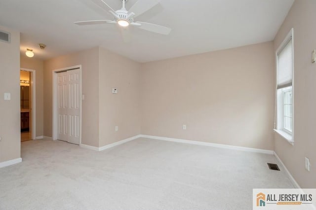 15 Dolley Madison Dr Unit 15C, Monroe, NJ 08831 - empty room with light carpet, ceiling fan, and baseboards