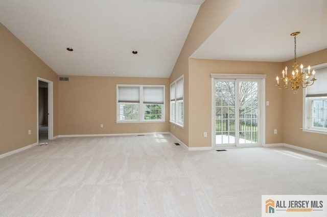 15 Dolley Madison Dr Unit 15C, Monroe, NJ 08831 - spare room featuring a chandelier, lofted ceiling, baseboards, and light carpet
