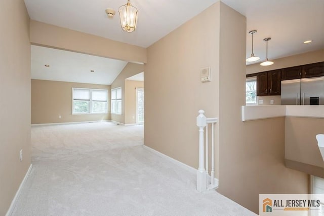 15 Dolley Madison Dr Unit 15C, Monroe, NJ 08831 - hallway with an upstairs landing, light carpet, baseboards, lofted ceiling, and a chandelier