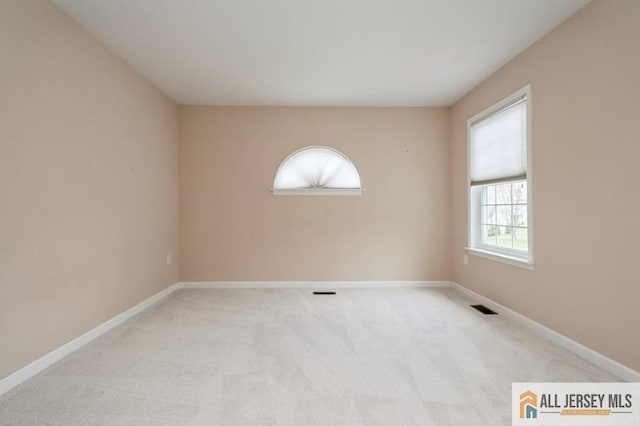 15 Dolley Madison Dr Unit 15C, Monroe, NJ 08831 - carpeted empty room with baseboards