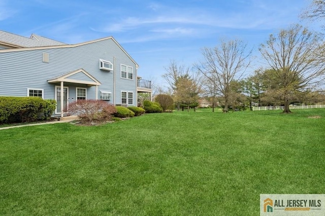 15 Dolley Madison Dr Unit 15C, Monroe, NJ 08831 - view of grassy yard with a wall mounted air conditioner