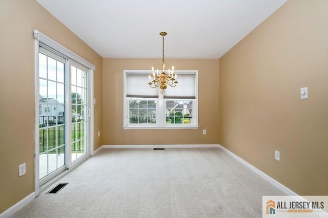 15 Dolley Madison Dr Unit 15C, Monroe, NJ 08831 - empty room with a chandelier, carpet flooring, and baseboards