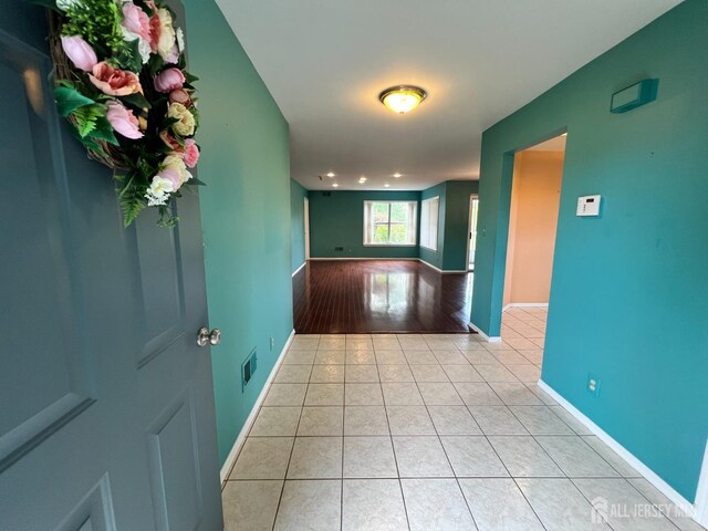 hallway with light tile patterned floors