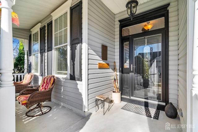 property entrance featuring covered porch