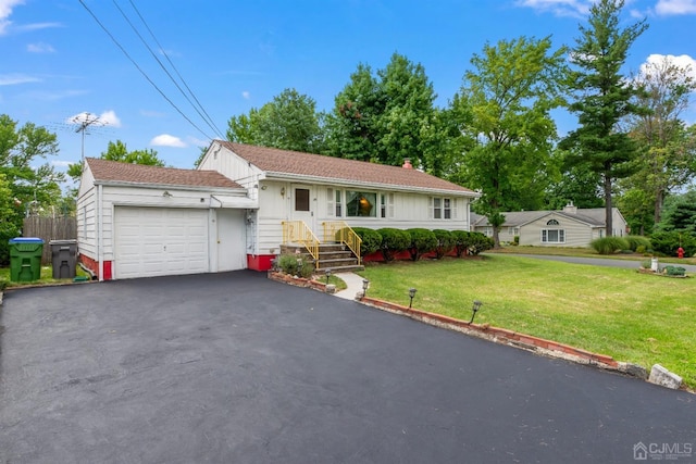 25 Lamar Ave, Edison, NJ 08820 - single story home featuring a garage, driveway, a front yard, a chimney, and board and batten siding