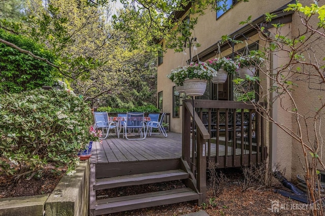 wooden deck with outdoor dining area