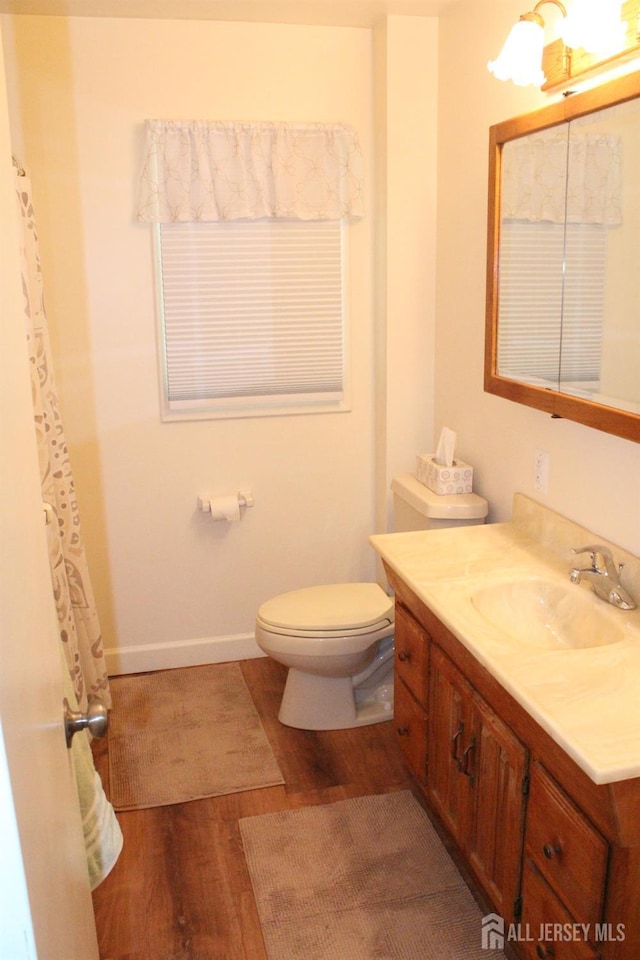 2 Haven Ter, Sayreville, NJ 08859 - full bathroom with wood finished floors, toilet, vanity, and baseboards
