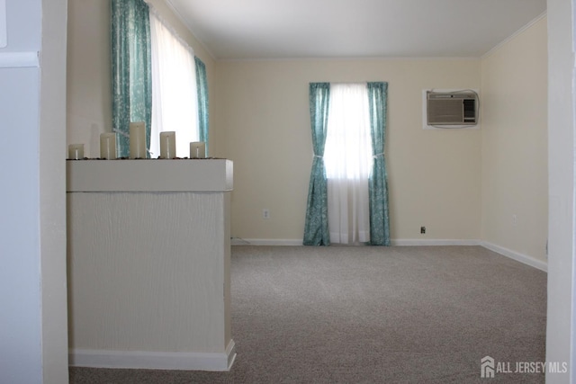 2 Haven Ter, Sayreville, NJ 08859 - unfurnished room featuring a wall mounted air conditioner, healthy amount of natural light, carpet floors, baseboards, and crown molding