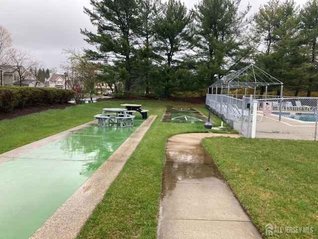 191 Wycoff Way W, East Brunswick, NJ 08816 - surrounding community with shuffleboard, a swimming pool, fence, a lawn, and a gazebo