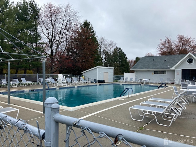 191 Wycoff Way W, East Brunswick, NJ 08816 - pool with an outdoor structure, a patio, and fence