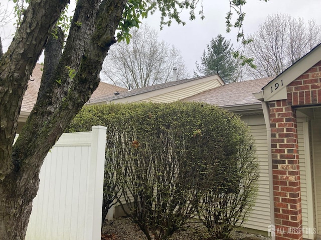 191 Wycoff Way W, East Brunswick, NJ 08816 - view of side of home featuring brick siding and roof with shingles